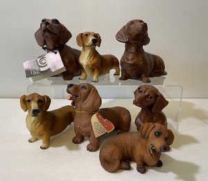 lot 347 image: Seven Hard Resin Dachshund Figurines