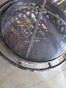 lot 14 image: Matte Black metal elevated Fire Pit with meshed cover
