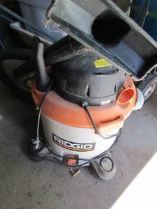 lot 26 image: Ridgid 12-gallon 5.0HP shop vac with hose and attachments shown