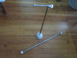 lot 46 image: Stainless steel and white ceramic accented free standing toilet paper holder and curtain rod