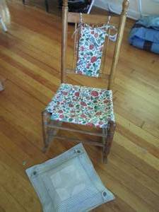 lot 60 image: Petite wood rocking chair with cloth seat and back covers