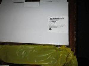 lot 98 image: Open box of Grabber hand warmers and never opened HP LaserJet Pro black replacement ink cartridge