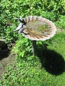 lot 100 image: Poly resin Outdoor bird bath with statuesque bird adornments along its surface
