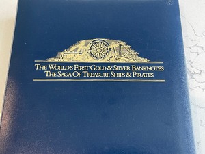 Gold and Silver Banknotes in Binder