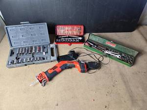 lot 138 image: Ratchets, Sockets, Black and Decker Cordless Saw