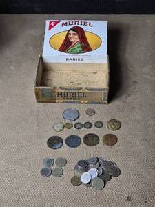 lot 174 image: Cigar Box (taped), Souvenir Saloon Tokens, Pile of Slot Machine Tokens