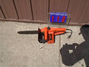 Remington 110 volt chainsaw. Looks nearly new. Tested & works. As shown.