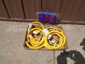 Flat of flexible gas lines. As shown.