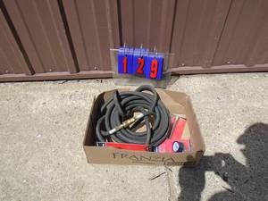 Flat of rubber air line hoses & air chucks. As shown.