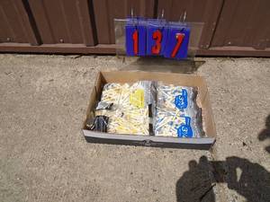 Flat of golf tees. As shown.