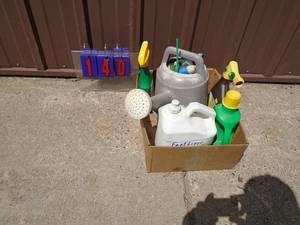 Box of outdoor chemicals & water can. As shown.