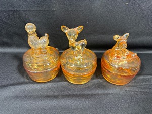 lot 52 image: Three Vintage Jeannette Glass Maigold Poodle, Deer and Dog Trinket Boxes
