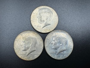 lot 19 image: Three 40% Silver Kennedy Half Dollars