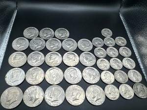lot 29 image: Twenty-Three Bicentennial Kennedy Half Dollars and Sixteen Bicentennial Washington Quarters
