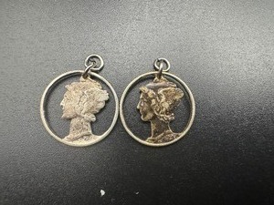lot 41 image: Two Vintage Mercury Dime Cutout Pendants.