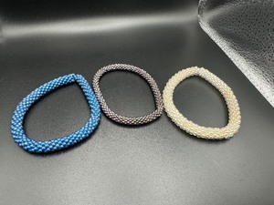 lot 258 image: Three Beaded Bracelets - Turquoise, White and Slivery Purple