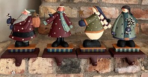 lot 86 image: Set of 4 Painted Cast Iron Christmas Stocking Holders #1