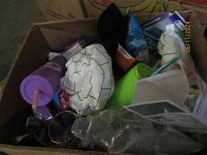 box of medicine , cups and more some in date some out of date