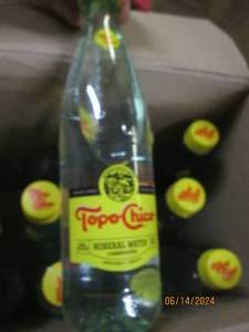 1215.5 oz bottles of topo chico mineral waters