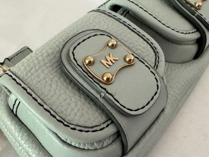 lot 83 image: Michael Kors Light Blue Roadie II Wristlet