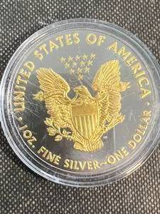 lot 61 image: 2018 AMERICAN SILVER EAGLE 1 TROY OZ .999 FINE SILVER GOLD PLATED IN AIRTITE