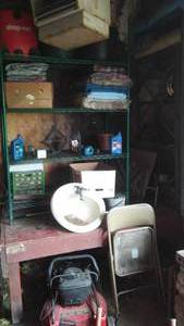 lot 668 image: Shelving with contents. DOES NOT include mounted propane heater.