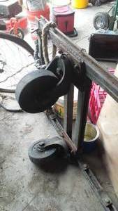 lot 673 image: 7 foot long low metal cart. 4 swivel casters .heavy duty.