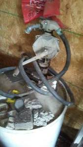 lot 675 image: Crank pump and barrel.