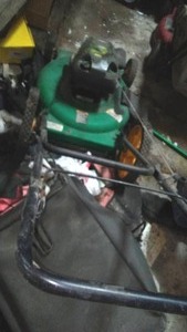 lot 688 image: Weed Eater push mower, high wheel, 22inch cut.4.75 HP pulls over well.