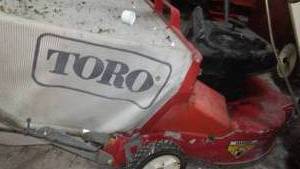 lot 692 image: Toro self propelled lawn mower.with bagger. pills over easy.