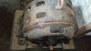 lot 699 image: Electric Motor. super large. hard to read faceplate. on castered frame