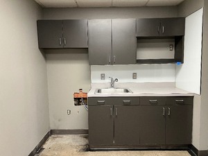 Upper and lower cabinets with countertop, sink and faucet. Upper is approx. 97.75 W and lower 64.5 W