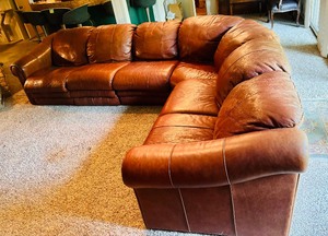 lot 149 image: Leather Stallion  Saddle Sectional by Royals Distinctive Furniture