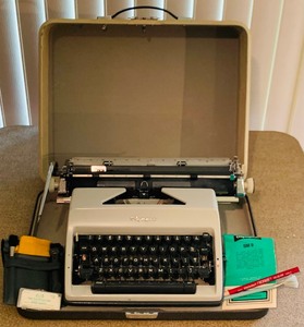 lot 95 image: Vintage Olympia Typewriter with Accessories and Carrying Case