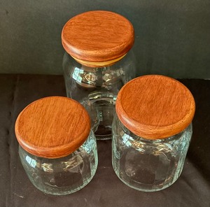 lot 375 image: Three Glass Canisters with Wooden Tops