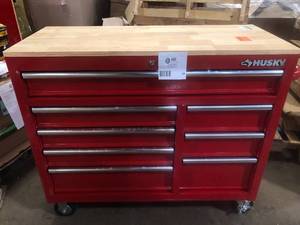 lot 50 image: Husky 42 in. W x 18.1 in. D 8-Drawer Red Mobile Workbench Cabinet with Solid Wood Top     Customer Returns See Pictures
