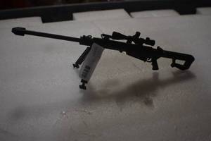 lot 2 image: 50 caliber metal ornament