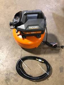 lot 16 image: RIDGID 6 Gal. Portable Electric Pancake Air Compressor Customer Returns See Pictures