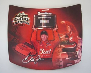 lot 14 image: Large Tin Replica HoodDale Earnhardt Jr. Daytona 500 Winner 2004 Mini Tribute Tin Hood with Original Plastic Peel-Off Coating Still Intact...