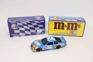 lot 224 image: #36 M & M 124 Action Racing NASCAR Die-Cast Car BANK...