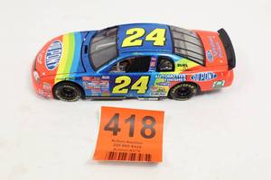 lot 418 image: 1999 Jeff Gordon #24 DuPont NASCAR Diecast 124