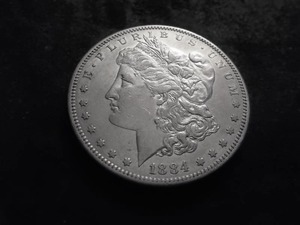 lot 15 image: 1884 S Morgan Silver Dollar