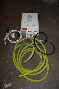 lot 41 image: Portable Tankless Water Heater and Accessories