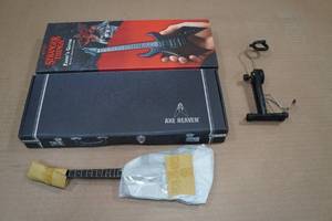 lot 117 image: Axe Heaven Stranger Things Eddies Guitar Mini Guitar Model