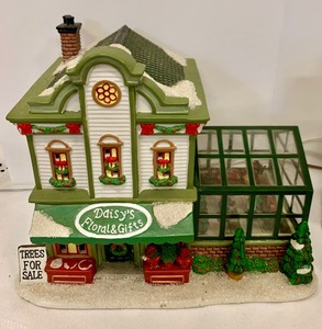 lot 139 image: Variety of Holiday Buildings from Department 56 and More Including LEMAX Lights and Sounds Christmas Manor.