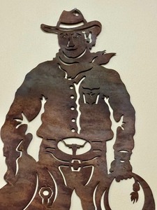 lot 115 image: Laser Cut Metal Cowboy Figurine  Cowboy with Saddle Wall Art