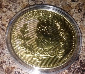lot 42 image: John Wick Continental Coin.