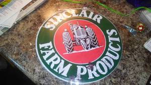 lot 44 image: Sinclair Farm Products Metal Sign 12 inch.