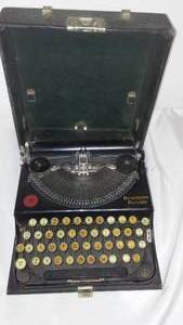 lot 231 image: Remington Portable Typewriter.