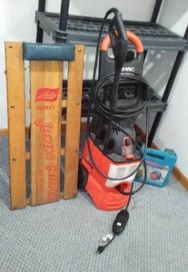 lot 285 image: Black And Decker Power Washer, Creeper, And Tire Chains.
